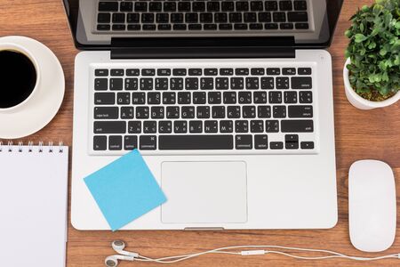 Top view laptop or notebook workspace office on wooden tableの写真素材
