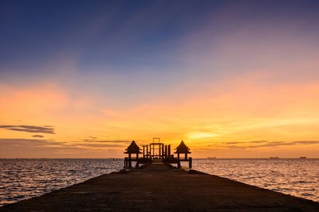 Twilight wood bridge at Djittabhawan Temple tourist attraction at Pattaya of Thailandの写真素材