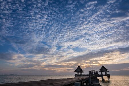Twilight wood bridge tourist attraction at Djittabhawan Temple Pattaya of Thailandの写真素材