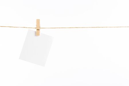 paper cards hanging rope isolated on white backgroundの写真素材
