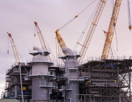 Industry crane and building construction site and blue skyのeditorial素材
