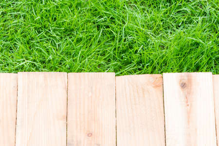 Wood on grass texture for your backgroundの写真素材