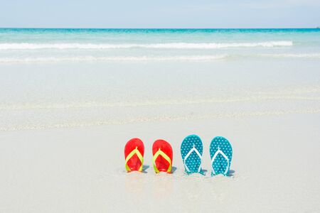 Beach, slippers on tropical beach in holiday at Thailandの写真素材