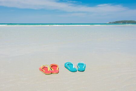 Beach, slippers on tropical beach in holiday at Thailandの写真素材