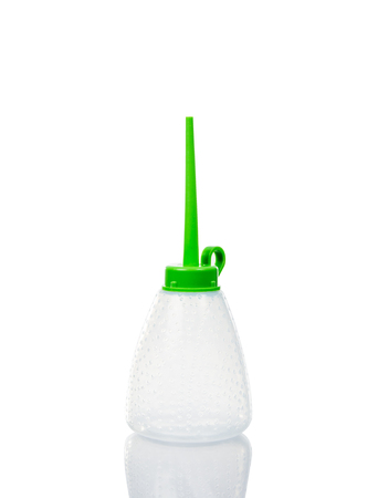 small plastic oiler can isolate on over white backgroundの写真素材