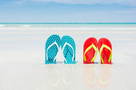 Beach, slippers on tropical beach in holiday at Thailandの写真素材