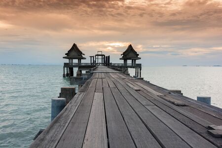 Twilight wood bridge at Djittabhawan Temple tourist attraction at Pattaya of Thailandの写真素材