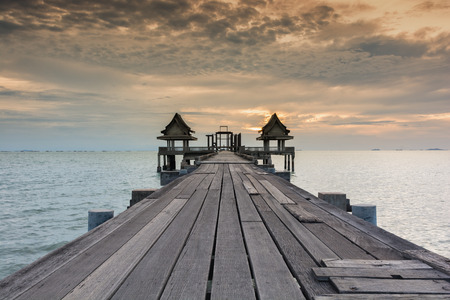 Twilight wood bridge at Djittabhawan Temple tourist attraction at Pattaya of Thailandの写真素材