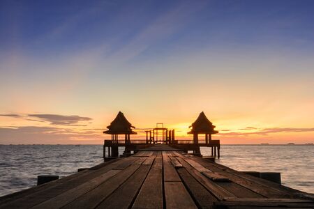 Twilight wood bridge at Djittabhawan Temple tourist attraction at Pattaya of Thailandの写真素材