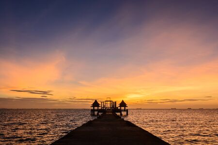 Twilight wood bridge at Djittabhawan Temple tourist attraction at Pattaya of Thailandの写真素材