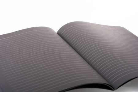 Black open book note on white backgroundの写真素材