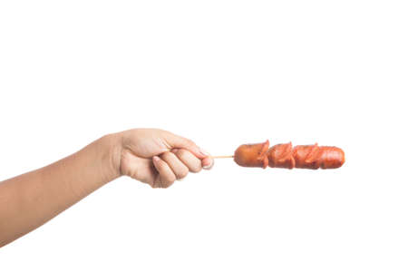 Grilled Sausage on fork isolated on over white backgroundの写真素材