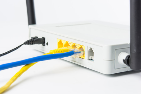 Wireless modem router network hub on white backgroundの写真素材