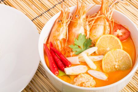 Tom Yum Goong, Thai hot spicy soup shrimp on wooden background, Thailand Foodの写真素材