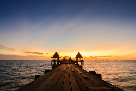 Twilight wood bridge at Djittabhawan Temple tourist attraction at Pattaya of Thailandの写真素材