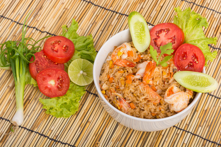 Special Shrimp fried rice in white cup on table with wooden backgroundの写真素材