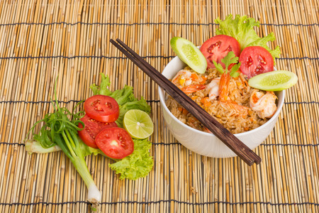 Special Shrimp fried rice in white cup on table with wooden backgroundの写真素材