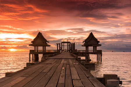 Twilight sunset wood bridge at Djittabhawan Temple tourist attraction in Pattaya, Thailandの写真素材