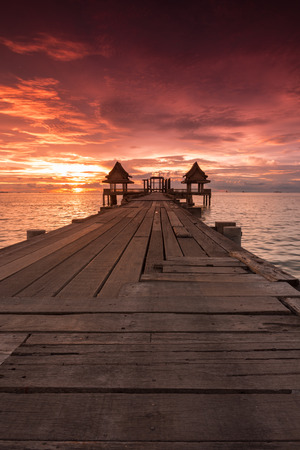 Twilight sunset wood bridge at Djittabhawan Temple tourist attraction in Pattaya, Thailandの写真素材
