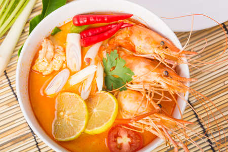 Tom Yum Goong, Thai hot spicy soup shrimp on wooden background, Thailand Foodの写真素材