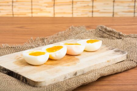 Organic Boiled Eggs Ready to Eat on wooden backgroundの写真素材