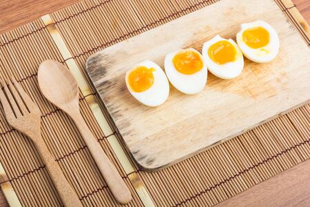 Organic Boiled Eggs Ready to Eat on wooden backgroundの写真素材