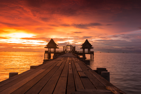 Twilight sunset wood bridge at Djittabhawan Temple tourist attraction in Pattaya, Thailandの写真素材