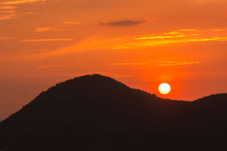 silhouette of the mountains at sunset gold lightingの写真素材