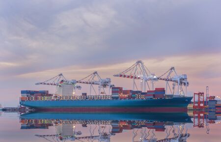 Cargo ship in Trade Port , Container loading Shipping by crane, Logistics , Transportation Systems