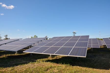 Photovoltaic solar energy panels for renewable electric production with blue skyの写真素材