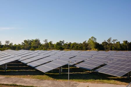 Photovoltaic solar energy panels farm for renewable energy or electricity with blue skyの写真素材