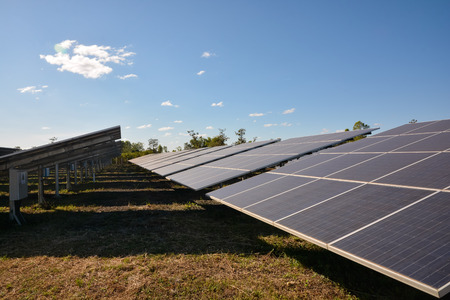 Photovoltaic solar energy panels for renewable electric production with blue skyの写真素材