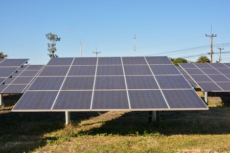 Photovoltaic solar energy panels and sunlight with blue skyの写真素材