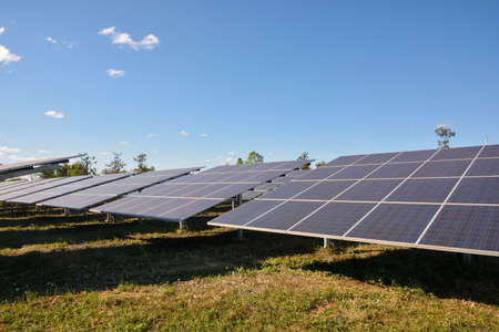 Photovoltaic solar energy panels for renewable electric production with blue skyの写真素材