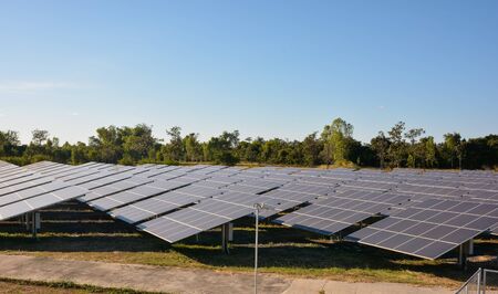Photovoltaic solar energy panels farm for renewable energy or electricity with blue skyの写真素材