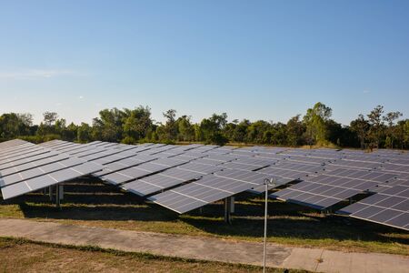 Photovoltaic solar energy panels farm for renewable energy or electricity with blue skyの写真素材