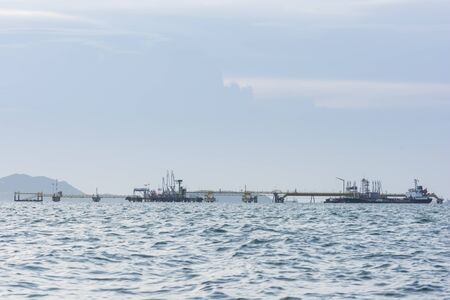 Oil Tanker in the sea on sunset lightの写真素材