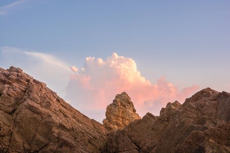 Sunset on the sea with Rocks stoneの写真素材