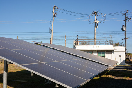 Photovoltaic solar energy panels farm for renewable energy or electricity with blue skyのeditorial素材