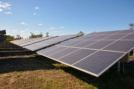 Photovoltaic solar energy panels for renewable electric production with blue skyの写真素材