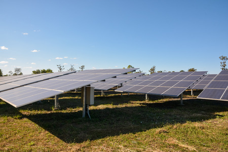 Photovoltaic solar energy panels and sunlight with blue skyの写真素材