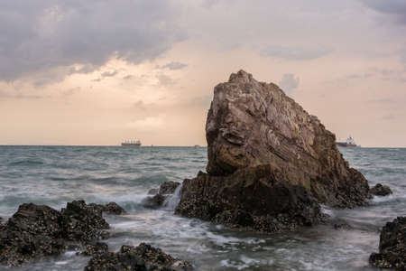 Sunset on the sea with Rocks stoneの写真素材