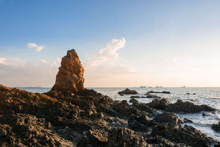 Sunset on the sea with Rocks stoneの写真素材