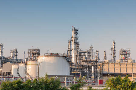 Gas tank oil petrochemical plant at sunsetの写真素材