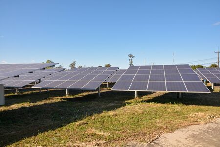 Photovoltaic solar energy panels and sunlight with blue skyの写真素材