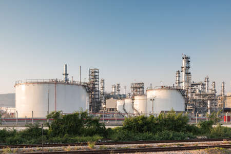 Gas tank oil petrochemical plant at sunsetの写真素材