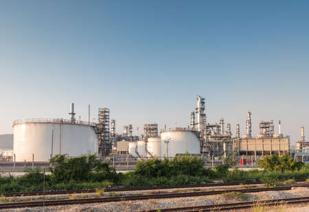 Gas tank oil petrochemical plant at sunsetの写真素材