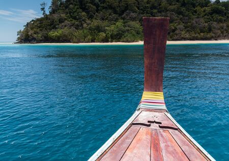 Prow of long tail boat traveling to island at KohRook island south of Thailandの写真素材