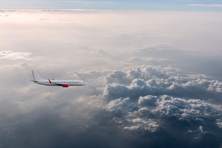 Airplane in the cloudy sky, Airliner, aircraftの写真素材