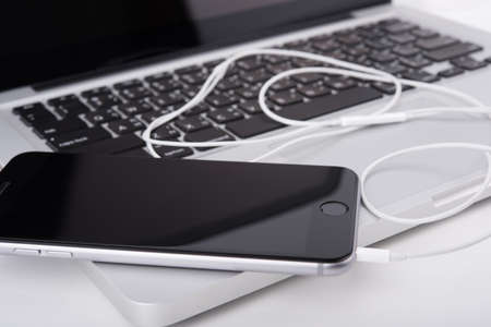 laptop,notebook and mobile phone, smartphone on office desk table.